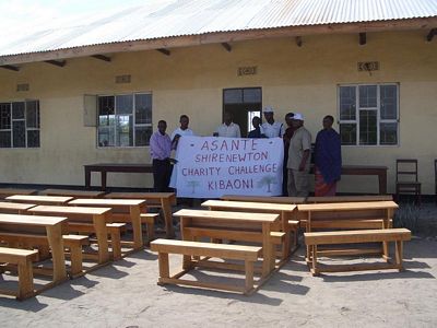Desks outside the school with Headmaster and Teachers
